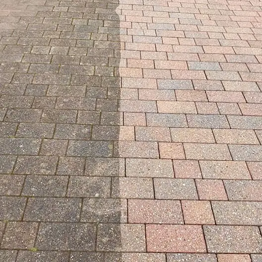 Block paving with the left half still dirty and the right half cleaned